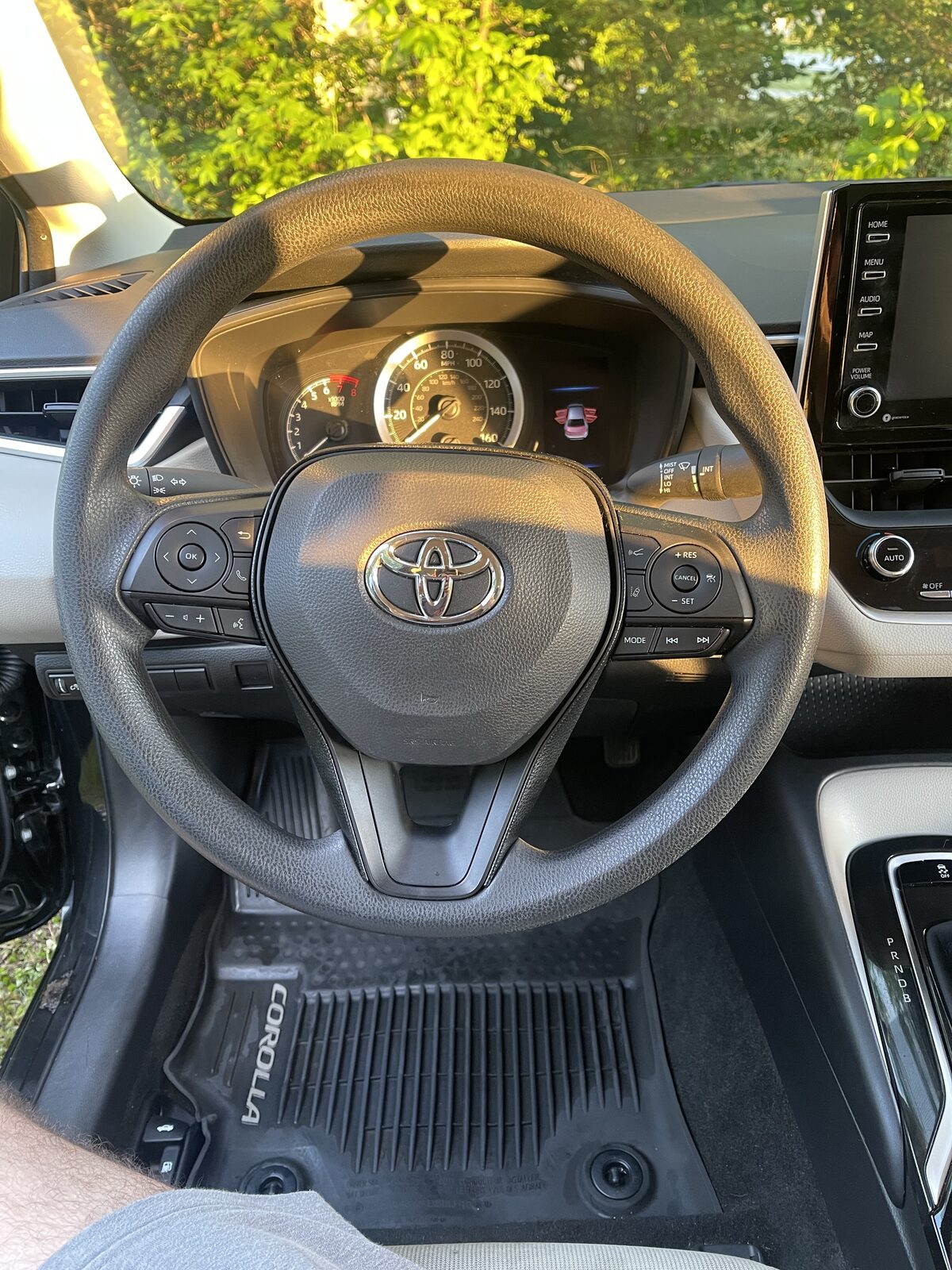 Toyota Corolla interior, freshly cleaned dashboard and steering wheel